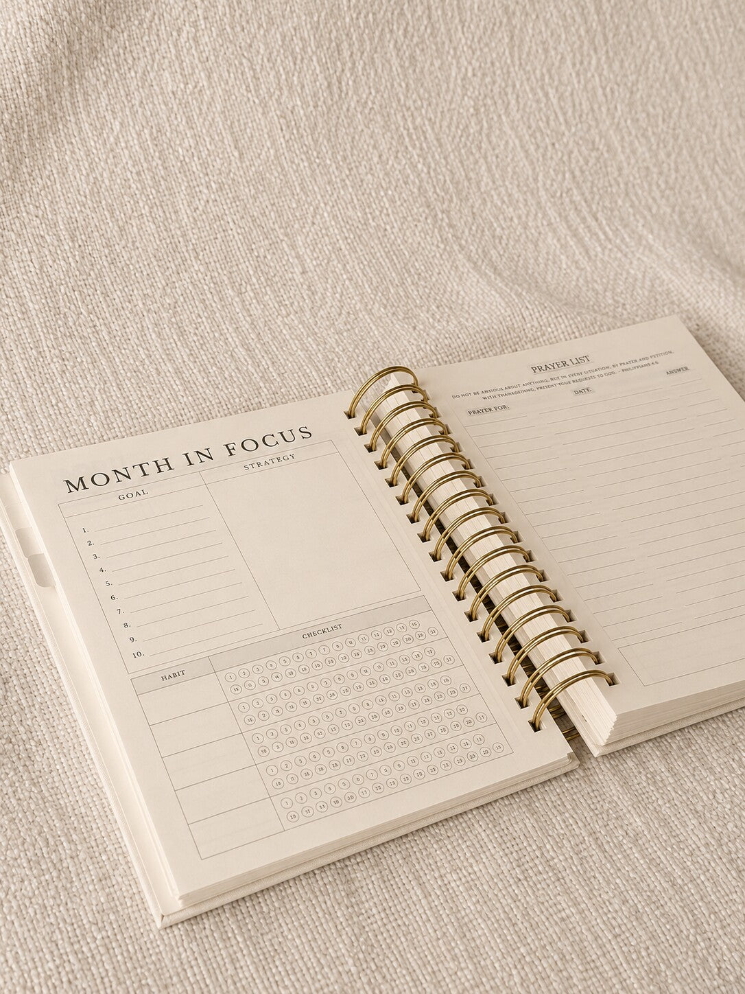 The Month in Focus spread with a monthly calendar, goals and a prayer list
