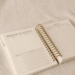 The Month in Focus spread with a monthly calendar, goals and a prayer list